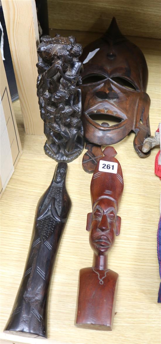 Four African tribal figures and a mask